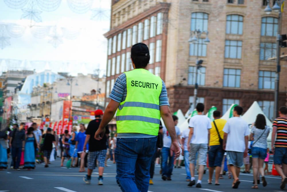 crowd control security guard guarding the parameter