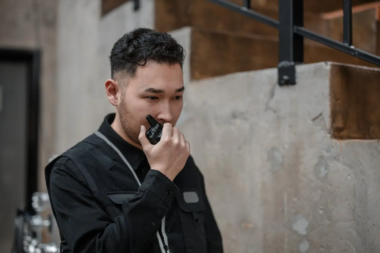 a security guard in melbourne talking on a walkie talkie